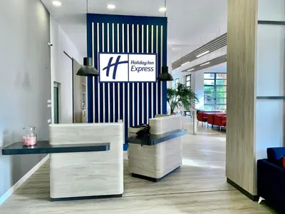 a lobby with a reception desk in a building at Holiday Inn Express Ciudad de las Ciencias by IHG in Valencia
