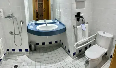 a bathroom with a sink and a toilet and a shower at Holiday Inn Express Ciudad de las Ciencias by IHG in Valencia