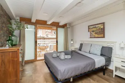 a bedroom with a bed with two teddy bears on it at Loft con terraza centro Valencia in Valencia