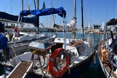 a boat is docked in a harbor at Velero en Puerto de Valencia - E&M Boats in Valencia
