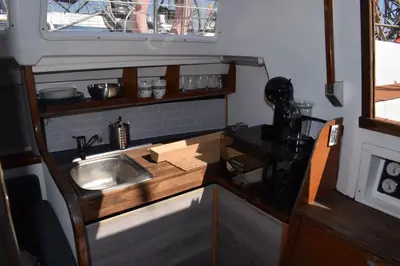 a kitchen with a sink and a counter top at Velero en Puerto de Valencia - E&M Boats in Valencia