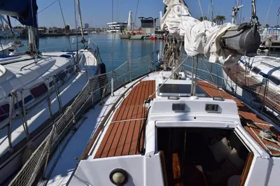 a small bed in a small room with two pillows at Velero en Puerto de Valencia - E&M Boats in Valencia