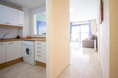 a kitchen with a washer and dryer in a room at ESPACIO 18 - Primera Línea de Playa in Cullera