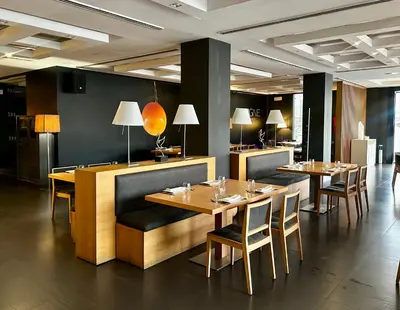 a living room with vases and a table and chairs at Hotel Ignacio - PalomarGroup in Chiva
