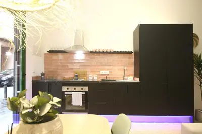 a kitchen with a stove and a counter top at Estudio Baleares Apartamento n3 in Valencia