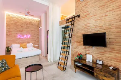 a living room with a brick wall at CHARMING LOFT IN RUZAFA, SOHO b2 in Valencia