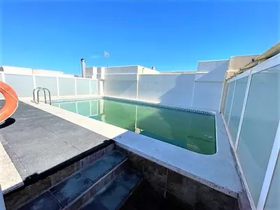 a swimming pool on the side of a building at Apartamento Grao de Moncofar REF. 041 in Moncófar
