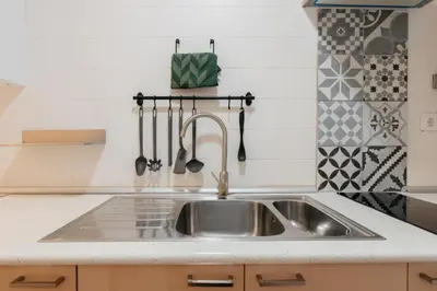 a kitchen with a sink and a counter top at Your Sunny & Spacious Portview Home in Valencia