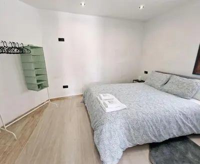 a bedroom with a bed with a tray on it at APARTAMENTO CON TERRAZA Y BARBACOA in Paterna