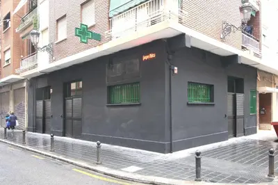 a black building on the side of a street at Loft Ibiza Apartamento n2 in Valencia