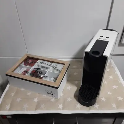 a cell phone and a box on a table at Exclusivo apartamento en Canet in Canet de Berenguer