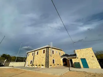 an old brick building on the side of a street at LA CASONA in Siete Aguas