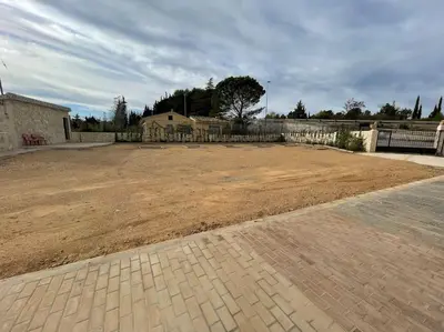 a large dirt yard with a fence and a house at LA CASONA in Siete Aguas