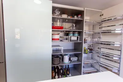 a kitchen with an open refrigerator with lots of food at Cullera Beach Apartment Cap Blanc in Cullera