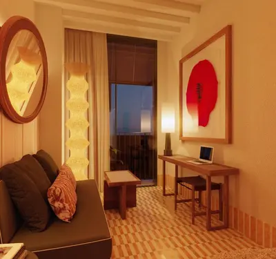a living room with a couch and a table with a laptop at Casa Bassa Hotel in Valencia
