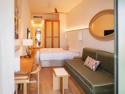 a hotel room with a bed and a couch at Casa Bassa Hotel in Valencia