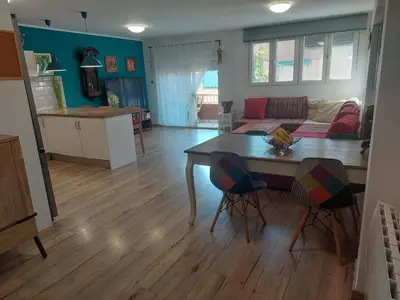 a living room with a table and a couch at Family Apartment Andrea in Alaquas