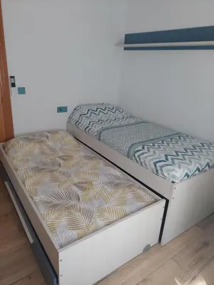 two bunk beds in a room with at Family Apartment Andrea in Alaquas