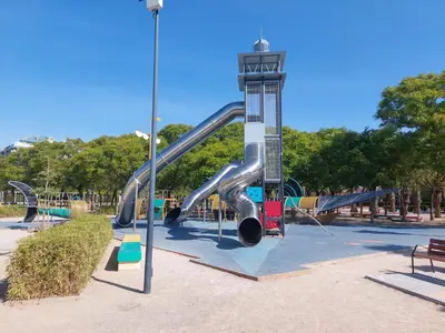 a playground with a slide in a park at Family Apartment Andrea in Alaquas