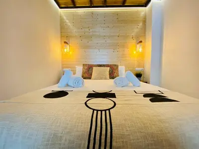 a bedroom with a large bed in a room at B1 Verdeguer - Flat close to the Beach in Valencia