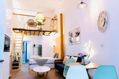 a room with a bunk bed and a living room at B2 Verdeguer - Cozy Loft close to the beach in Valencia