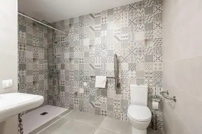 a bathroom with a toilet and a sink at El Mosaico Apartment in Valencia