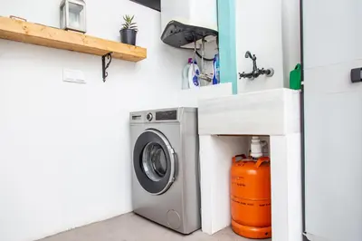 a laundry room with a washer and dryer at Maritime House Valencia Beach in Valencia