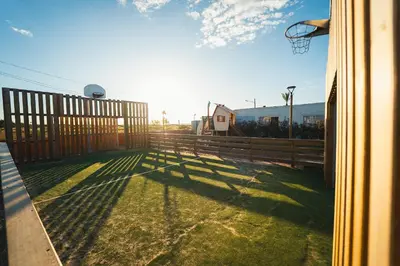 a basketball hoop on a fence in a yard at HolaCamp Chilches in Xilxes