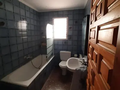 a bathroom with a toilet and a tub and a sink at Villa near Valencia with Private Pool in Valencia