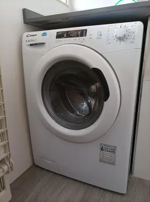 a white washing machine sitting in a room at Almar Collection Cullera AT in Cullera