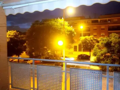 a view of a city street at night with street lights at Precioso apartamento en Puerto de Sagunto Valencia in Puerto de Sagunto