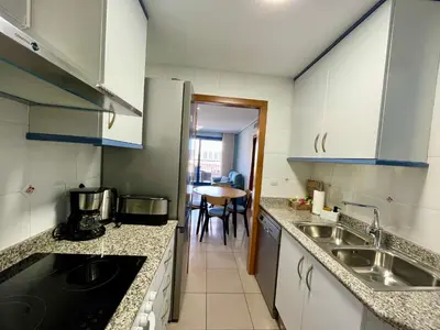 a kitchen with a sink and a counter top at Blue Beach Apartment+Oceanview+Private Parking in Valencia