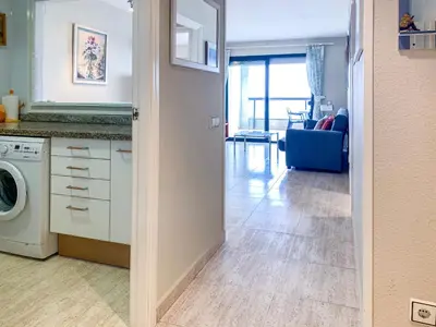 a kitchen and living room with a washer and dryer at ESPACIO 8 - Primera Línea de Playa in Cullera