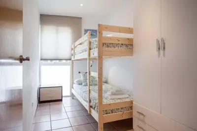 a bedroom with two bunk beds in a room at Zerka Ayuntamiento in Valencia