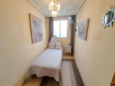 a small room with a bed and a window at 3 bedroom Flat with WiFi in Valencia