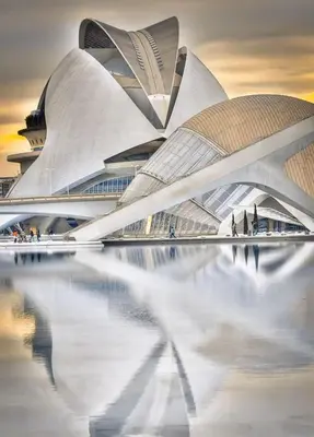 a view of a building with its reflection in the water at Valencia Doble A Deluxe in Valencia