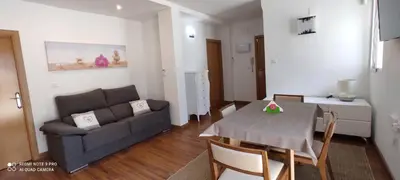 a living room with a couch and a table at Mi pequeña terraza in Alaquas