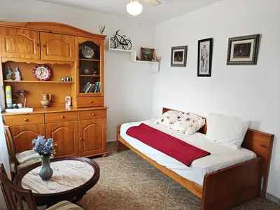 a bedroom with a bed and a dresser and a window at Buenas vistas y privacidad, tranquila y fresca villa en el bosque de Valencia con una magnífica piscina de 80m2 in Lliria