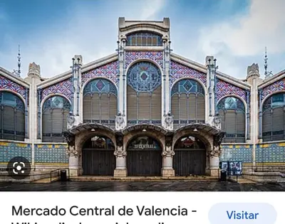 a large building with mosaics on the front of it at Valencia Centro andando y Playa malvarrosa tranvía in Valencia