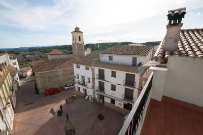 an aerial view of a city with buildings and a tower at Apartamento Paco entre Valencia y Castellón in Benafer