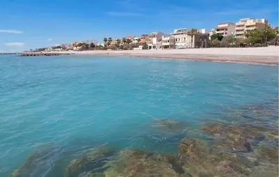 a view of a beach with rocks in the water at Gorgeous Apartment In Playa De Moncofa in Moncófar