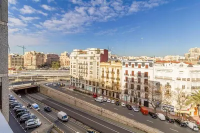 a view of a city with cars and buildings at Gran Vía by District Key in Valencia