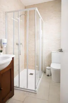 a bathroom with a shower with a toilet and a sink at Nest Silence in Valencia