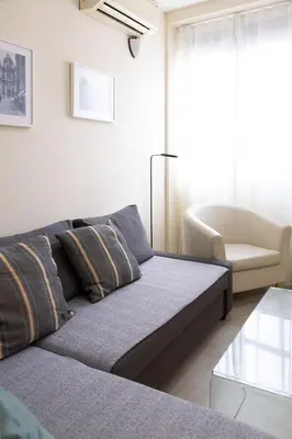 a living room with a couch and a chair at Nest Silence in Valencia