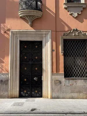 a large black door on the side of a building at Nest Silence in Valencia