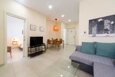 a living room with a couch and a television at Nest Silence in Valencia