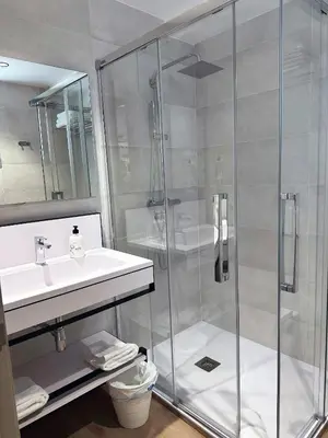 a bathroom with a shower and a sink at Hotel BESTPRICE Valencia in Valencia
