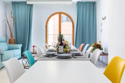 a dining room with a table and chairs at Grand Villa Valencia - 8 min to Center by Metro in Valencia