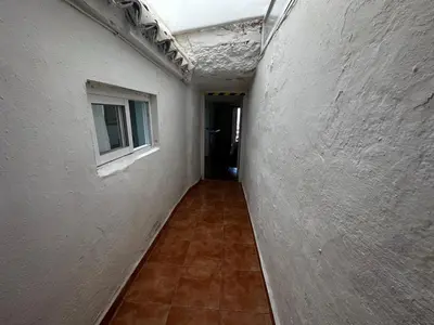an empty hallway of a building with a window at LA CUEVA de TONI EL SECO in Paterna