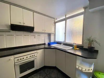 a kitchen with white cabinets and a sink and a window at FLAT FAMILY NEAR BEACH GARDEN CENTER AND METRO in Valencia
